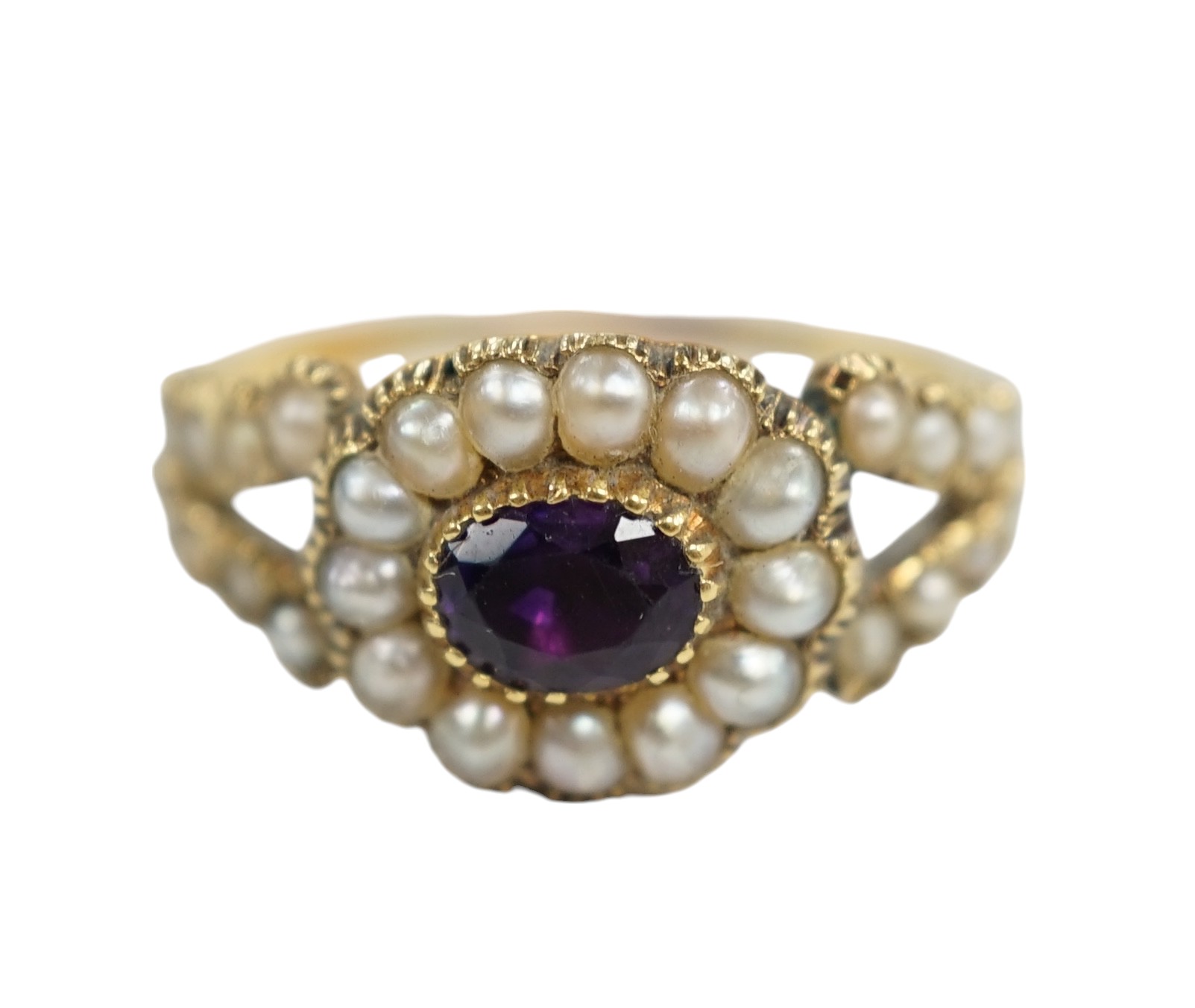 A Victorian yellow metal amethyst and seed pearl cluster set ring, size P/Q, gross weight 3 grams. Condition - poor